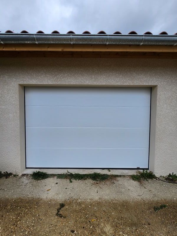 Pose d'une porte de garage sectionnelle 